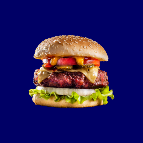 Hamburguesa completa con carne, queso y vegetales para el curso de manipulador de alimentos en hostelería y restauración.